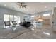 Open living space with marble floors, modern furniture, and kitchen views at 10226 N 171St Dr, Waddell, AZ 85355