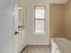 Bathroom with tub, vanity, and window at 10426 N 11Th St # 3, Phoenix, AZ 85020