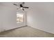 Spacious bedroom featuring a ceiling fan and window at 10426 N 11Th St # 3, Phoenix, AZ 85020