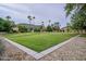Well-maintained green space with mature trees, and desert landscaping, offering a serene environment at 10426 N 11Th St # 3, Phoenix, AZ 85020