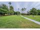 Green space with a manicured lawn, desert landscaping, and tall palm trees with mountain views at 10426 N 11Th St # 3, Phoenix, AZ 85020