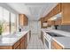 Bright kitchen features white countertops and wood cabinets at 10426 N 11Th St # 3, Phoenix, AZ 85020