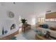 Bright living room features a fireplace, hardwood floors, and a neutral color scheme at 10426 N 11Th St # 3, Phoenix, AZ 85020
