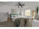 Relaxing main bedroom boasts a modern ceiling fan, comfortable carpet, and natural light at 10426 N 11Th St # 3, Phoenix, AZ 85020