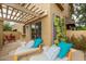 Inviting patio features lounge chairs, stylish cushions, and a pergola, perfect for outdoor relaxation at 10426 N 11Th St # 3, Phoenix, AZ 85020