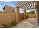 Stone patio with pergola and lush plants at 10426 N 11Th St # 3, Phoenix, AZ 85020