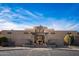 Exterior view of the Coyote Lakes Golf Clubhouse, featuring Southwestern architecture at 11599 W Iron Mountain Ct, Surprise, AZ 85378