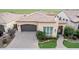 Single-story home with a two-car garage and landscaped yard at 1175 E Copper Holw, Queen Creek, AZ 85140