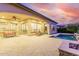 Spacious backyard with a sparkling pool, fire pit, and patio at 1175 E Copper Holw, Queen Creek, AZ 85140