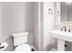 Stylish bathroom with pedestal sink and modern fixtures at 1175 E Copper Holw, Queen Creek, AZ 85140
