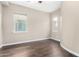 Bedroom with hardwood floors and two windows at 1175 E Copper Holw, Queen Creek, AZ 85140