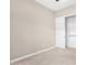 Well-lit bedroom with neutral walls and closet at 1175 E Copper Holw, Queen Creek, AZ 85140