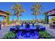 Blue tile fountain with seating and palm trees at 1175 E Copper Holw, Queen Creek, AZ 85140