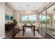 Bright dining room featuring a large table, chandelier, and sliding glass doors leading outdoors at 1175 E Copper Holw, Queen Creek, AZ 85140