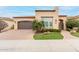 House exterior with a two-car garage and walkway at 1175 E Copper Holw, Queen Creek, AZ 85140