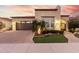 Beautiful single-story home with a landscaped front yard and a two-car garage at 1175 E Copper Holw, Queen Creek, AZ 85140