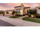 Tan colored stucco home with a lush green lawn at 1175 E Copper Holw, Queen Creek, AZ 85140