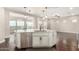 Gourmet kitchen with large island, stainless steel appliances, and granite countertops at 1175 E Copper Holw, Queen Creek, AZ 85140