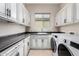 Laundry room with washer, dryer, and cabinets at 1175 E Copper Holw, Queen Creek, AZ 85140