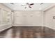Living room with hardwood floors and multiple windows at 1175 E Copper Holw, Queen Creek, AZ 85140