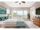 Spacious main bedroom with large windows, providing ample natural light and a view at 1175 E Copper Holw, Queen Creek, AZ 85140