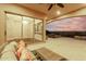 Covered patio with pool and sunset view at 1175 E Copper Holw, Queen Creek, AZ 85140