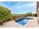 Inviting rectangular pool with stone coping and a spacious patio at 1175 E Copper Holw, Queen Creek, AZ 85140