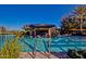 Resort-style pool with swim-up bar and lounge chairs at 1175 E Copper Holw, Queen Creek, AZ 85140