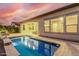 Inviting swimming pool with a water feature in the backyard at 1175 E Copper Holw, Queen Creek, AZ 85140