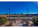 Well-maintained tennis court with surrounding landscaping at 1175 E Copper Holw, Queen Creek, AZ 85140