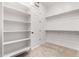Large walk-in closet with shelves and hanging space at 1175 E Copper Holw, Queen Creek, AZ 85140