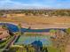 Tennis courts and canal views from above at 1233 E Salado Cir, Mesa, AZ 85203