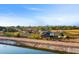 Rural residential area with canal and distant mountains at 1233 E Salado Cir, Mesa, AZ 85203