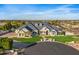 Large estate home with circular driveway and beautifully landscaped lawn at 1233 E Salado Cir, Mesa, AZ 85203