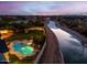 Luxury property with a pool and canal views at sunset at 1233 E Salado Cir, Mesa, AZ 85203