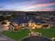 Elegant home with a three-car garage and beautifully landscaped yard at 1233 E Salado Cir, Mesa, AZ 85203