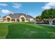 Large backyard showcasing a home's rear elevation and playset at 1233 E Salado Cir, Mesa, AZ 85203