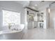 Elegant Primary bathroom with freestanding tub, double vanity, and hexagon tile floor at 1233 E Salado Cir, Mesa, AZ 85203