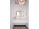 Powder room with floating vanity and decorative mirror at 1233 E Salado Cir, Mesa, AZ 85203