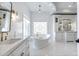 Spa-like bathroom with a freestanding tub and white hex tile at 1233 E Salado Cir, Mesa, AZ 85203