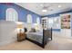 Charming bedroom with blue walls, built-in shelving, and a comfortable bed at 1233 E Salado Cir, Mesa, AZ 85203