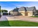 Long driveway with a basketball court and attached garage at 1233 E Salado Cir, Mesa, AZ 85203