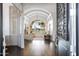 Elegant entryway with high ceilings, arched windows, and hardwood floors at 1233 E Salado Cir, Mesa, AZ 85203