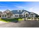 Stunning home featuring manicured landscaping, a circular driveway, and a sophisticated architectural design at 1233 E Salado Cir, Mesa, AZ 85203