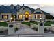 Evening view of the home's entrance and landscaping at 1233 E Salado Cir, Mesa, AZ 85203