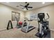 Well-equipped home gym with treadmill, elliptical and weights at 1233 E Salado Cir, Mesa, AZ 85203