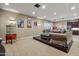 Basement home theater with large sectional sofa, popcorn machine, and entertainment center at 1233 E Salado Cir, Mesa, AZ 85203