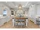Bright kitchen featuring a wood island, white cabinetry, and high-end appliances at 1233 E Salado Cir, Mesa, AZ 85203