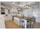 Elegant kitchen with white cabinets, wood countertops, and a spacious island at 1233 E Salado Cir, Mesa, AZ 85203
