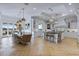 Spacious kitchen with white cabinets, a large island, and herringbone floors at 1233 E Salado Cir, Mesa, AZ 85203